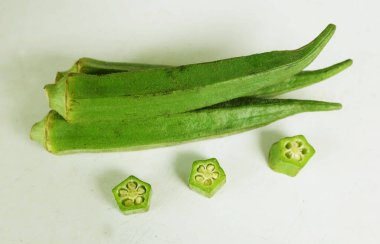 young raw okra, ladys finger, gombo, gumbo, bendee, quimbamto (hisbicus esculentus l.) vegetables .flat lay