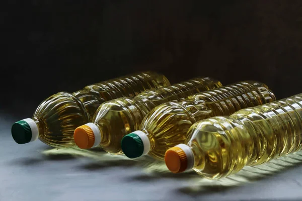 Bottles Sunflower Oil Lie Black Table — Stock Photo, Image