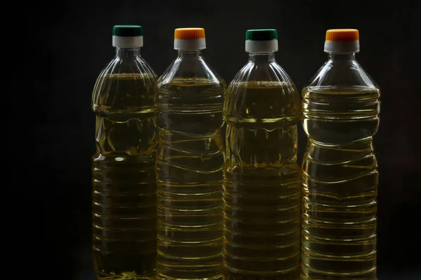 Botellas Aceite Girasol Yacen Sobre Una Mesa Negra —  Fotos de Stock