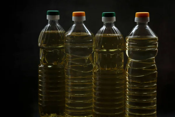 Bottles Sunflower Oil Lie Black Table — Stock Photo, Image