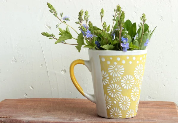 Wildflowers in a cup — Stock Photo, Image