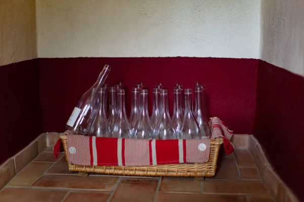 empty wine bottles in a basket in the natural interior