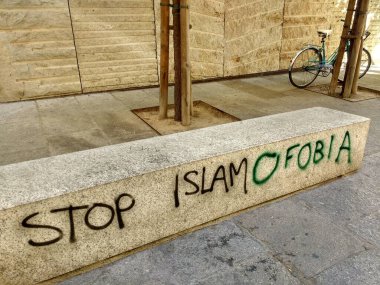 Graffiti of an unknown person on the street talking about islamophobia, Zamora, Spain clipart