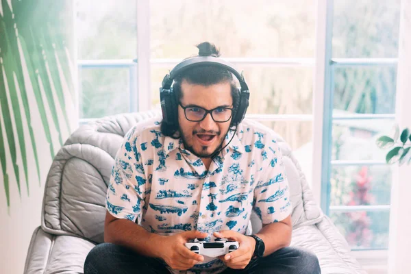 Latin Man Sitting Sofa Surprised While Playing His Console Has — Stock Photo, Image