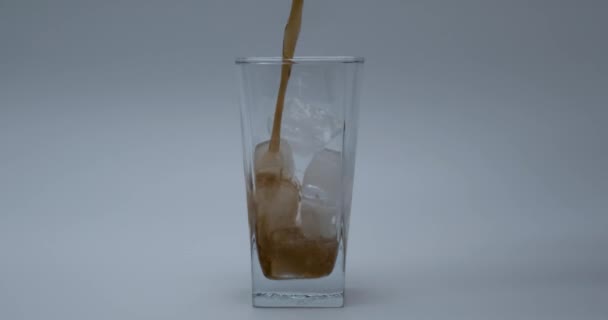 Pouring Cola Glass Ice Cubes Close White — Stock Video