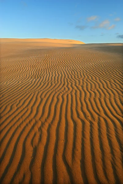 Appelsiini pehmeä aavikon hiekka — kuvapankkivalokuva
