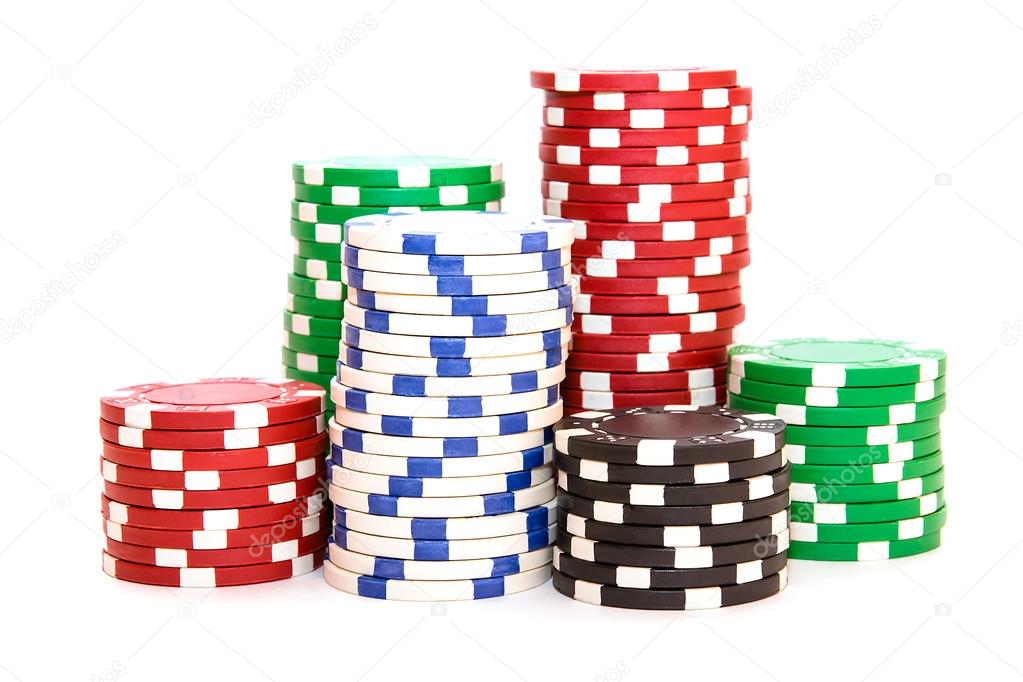 Stacks of poker chips including red, black, white and green on a