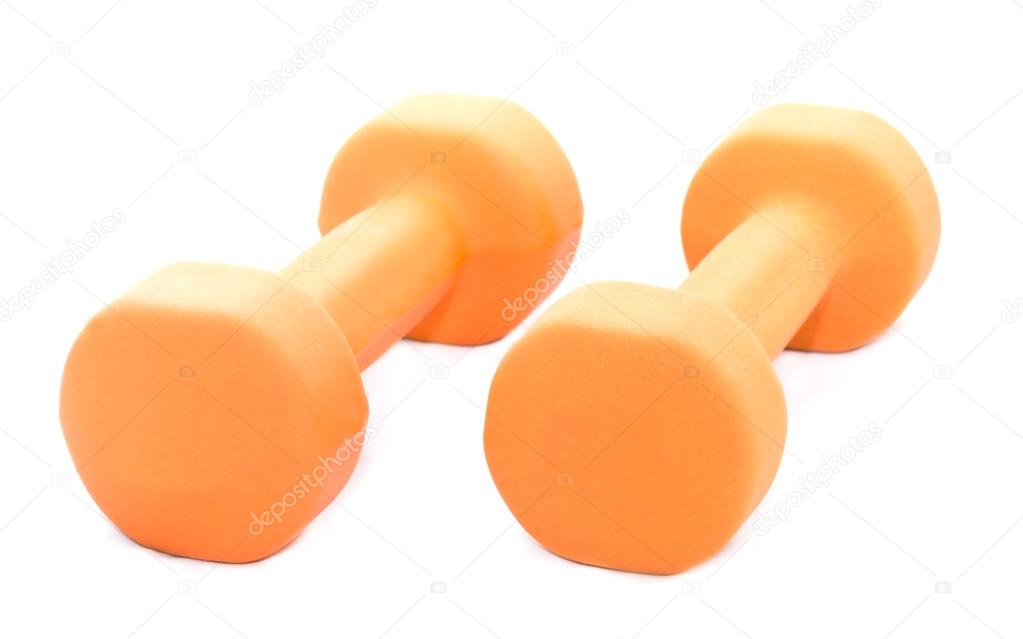 Two orange dumbbells isolated on white background