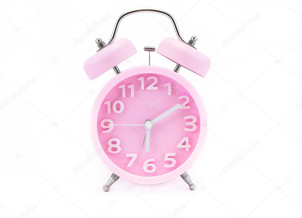 Pink alarm clock isolated on white