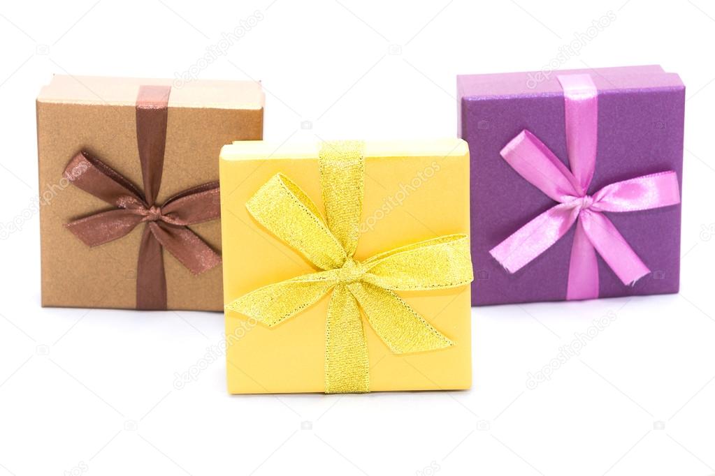 Three gift boxes with ribbon isolated on white background