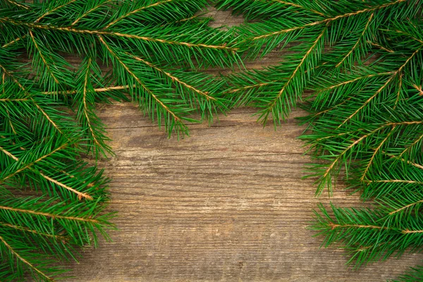 Urlaub Hintergrund mit Tanne auf Holzgrund — Stockfoto