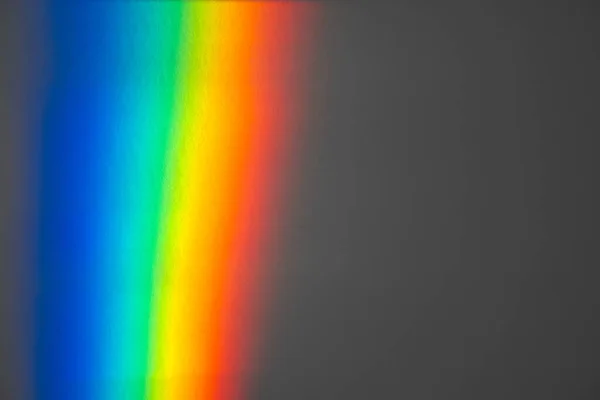 A Prism Full Rainbow Light on grey paper Background Overlay