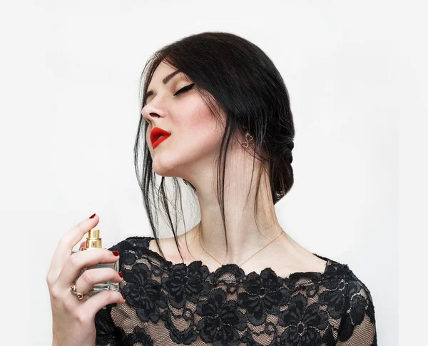 Woman with perfume on the white background — Stock Photo, Image