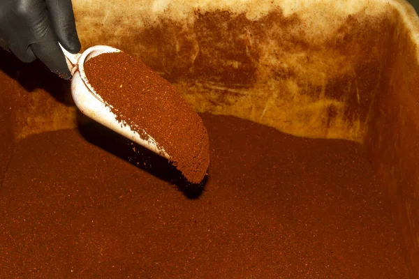 Ground coffee prepared to be packaged in a coffee roasting company