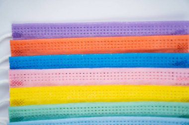 multicoloured protective masks on a white background