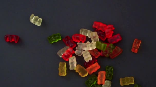 Green Yellow Red White Colour Gummies Falling Gray Background — Stockvideo
