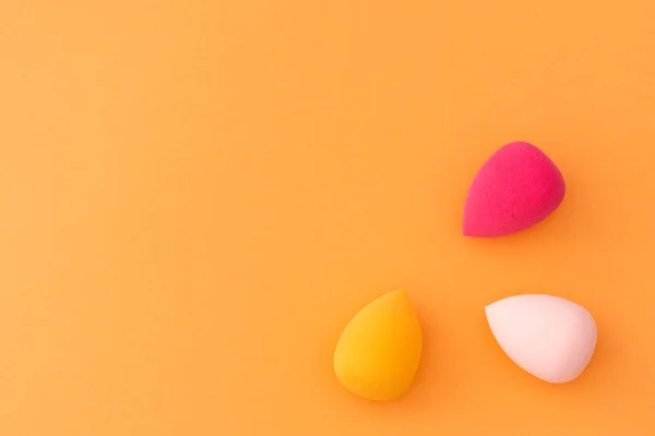 Makeup sponges round shape on a gentle blue background