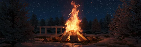 눈덮인 소나무와 앞에서 불꽃과 입자들과 커다란 모닥불을 연주하는 — 스톡 사진