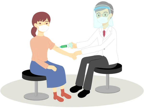 Aşılanmış kadın ve doktorlar (maskeler ve yüz kalkanları)