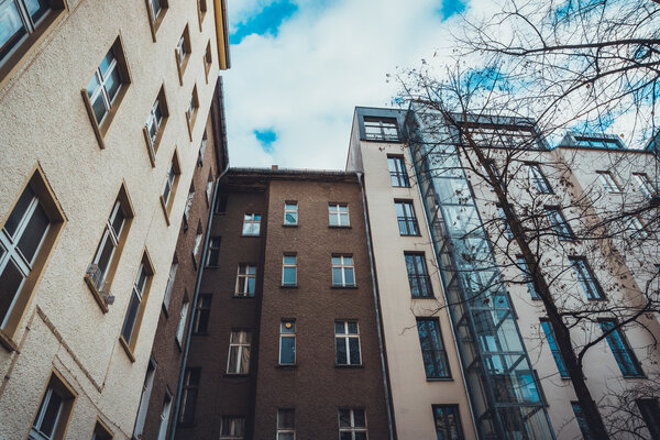 patio in low angle view and yellow and brown houses
