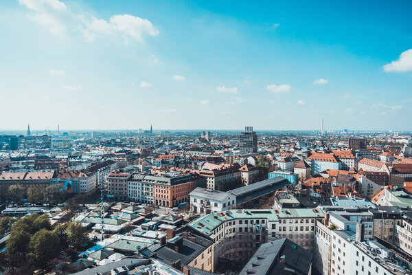 Scenic Overview of City of Munich on Sunny Day with Bright Blue Sky and White Clouds, Munich, Germany