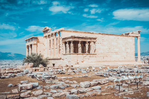 Ancient Greek temple ruins under blue sky