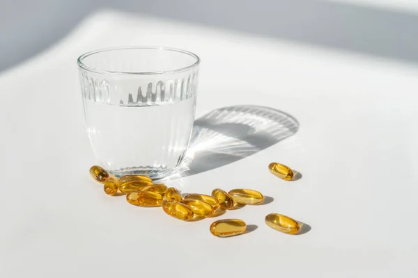 Oil filled capsules on the white background — Stock Photo, Image