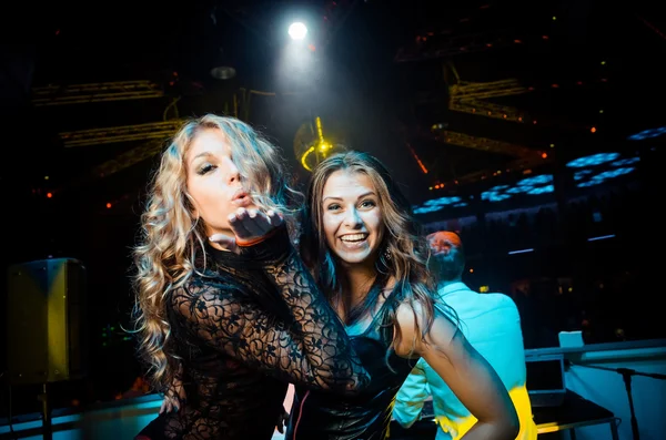 Two girls sending a kiss Stock Picture