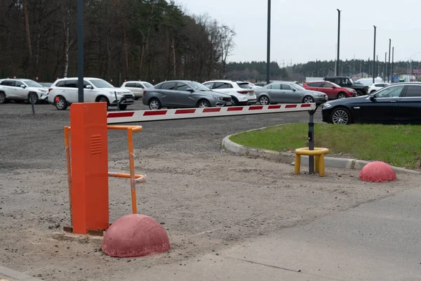 Security barrier of a parking lot. Closed passage.