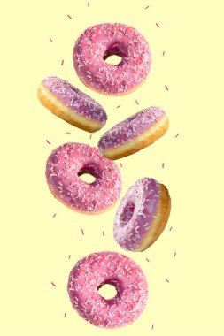 Sarı arka planda uçan çörekler. Pembe çörekler uçuyor