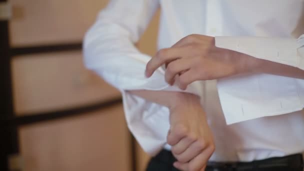 Close up of a mans grooms hand while fastening cuff — Stock Video