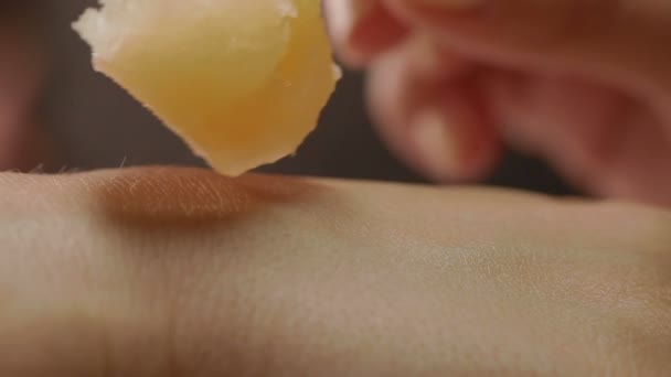 Beautiful hand receiving spa treatment with honey — Stock Video