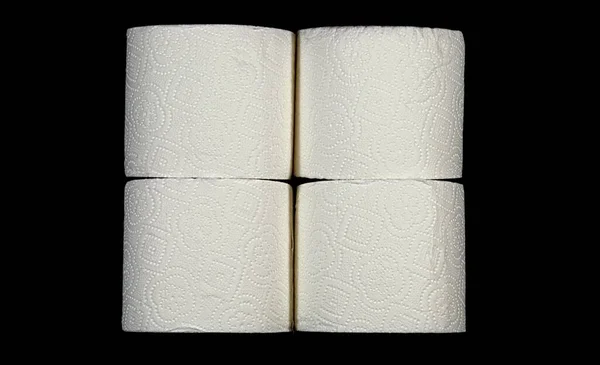 Cztery Rolki Papieru Toaletowego Ułożone Dwóch Stosach — Zdjęcie stockowe