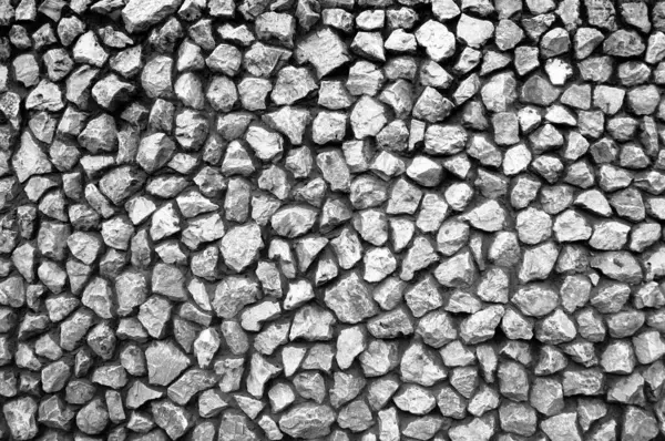 Mozaik şeklinde bir taş duvar..