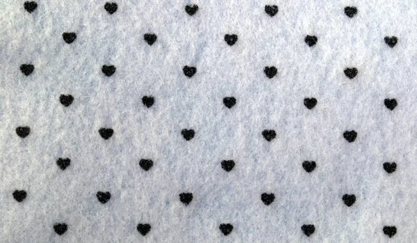 Tło Wykonane Jest Białej Tkaniny Czarnych Serc Tekstura — Zdjęcie stockowe