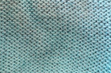 Örülmüş mavi bir kumaşın dokusu. Kumaş arkaplanı