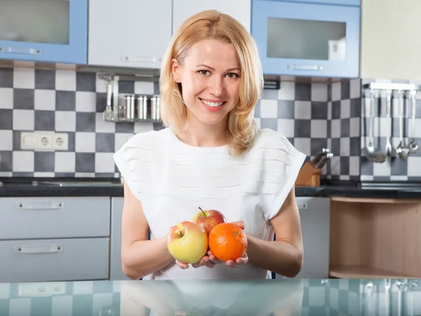 Woman holding  fresh fruits in hands — Stock Photo, Image