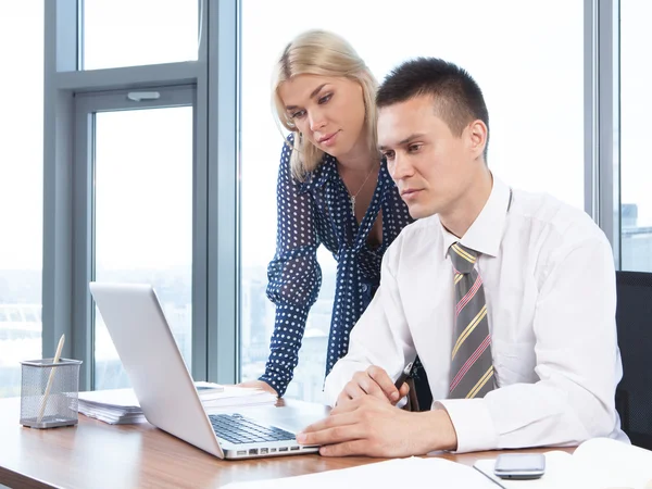 Business people working together on laptop in office — Stock Photo, Image