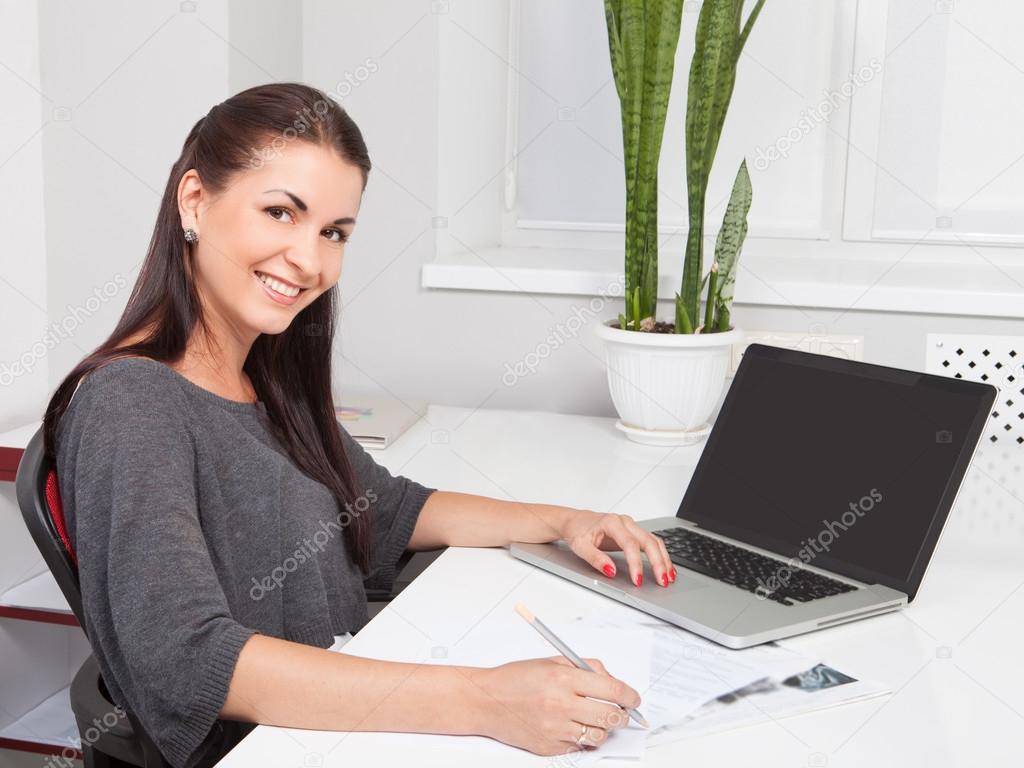 Business woman working on laptop 
