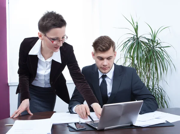 Business people working together on laptop in office — Stock Photo, Image