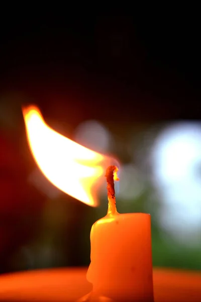 fire from a white candle stick