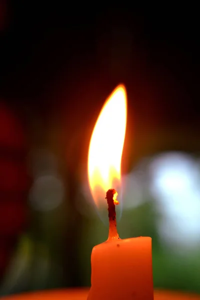 fire from a white candle stick