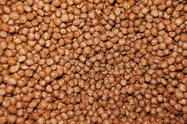 This is floating fish food for fish, granular in shape with a diameter of 4 millimeters