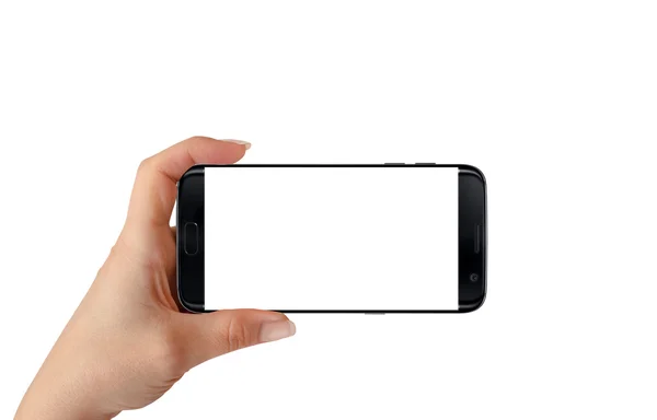 水平位置の女性の手で現代の黒いスマートフォン。モックアップ用のホワイトスクリーン、隔離. — ストック写真