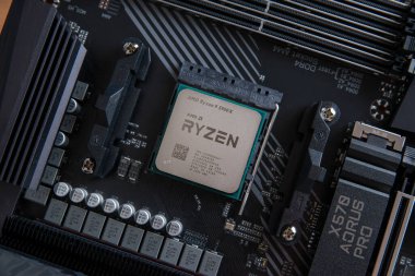 Sarajevo, Bosnia and Herzegovina - December 29, 2020: The desktop Ryzen 5000 series processor, based on the Zen 3 microarchitecture in AM4 motherboard socket clipart
