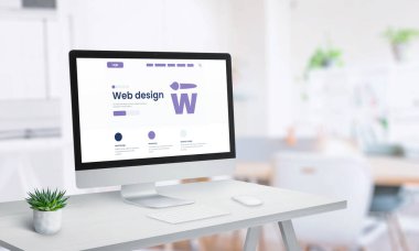 Bilgisayar ekranında web tasarımı stüdyo sayfası konsepti. Klavyesi, faresi ve bitkisi olan temiz ofis masası