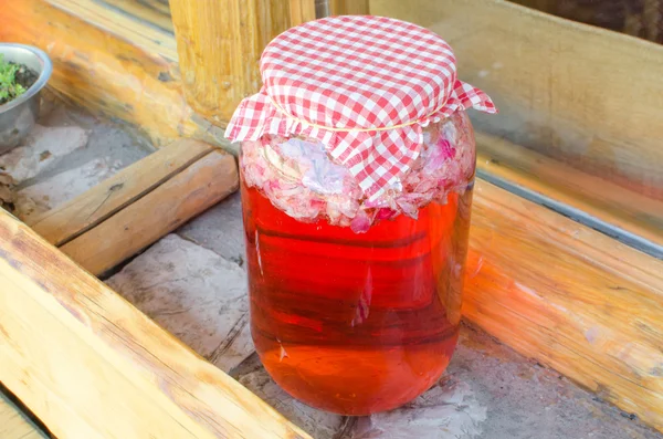 Juice of roses in a jar — Stock Photo, Image