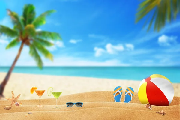 Summer accessories on sandy beach — Stock Photo, Image