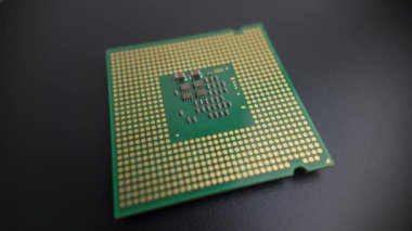 Çağdaş bir CPU 'nun makro dönüşümlü görünümü pimsiz, donanım, elektronik ve teknik sunumlar için temas yastıkları ve işlemci yapısını gösterir