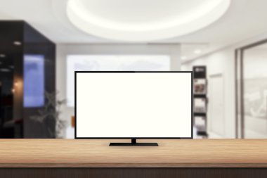 isolated tv on wooden desk in office background for mock up presentation clipart